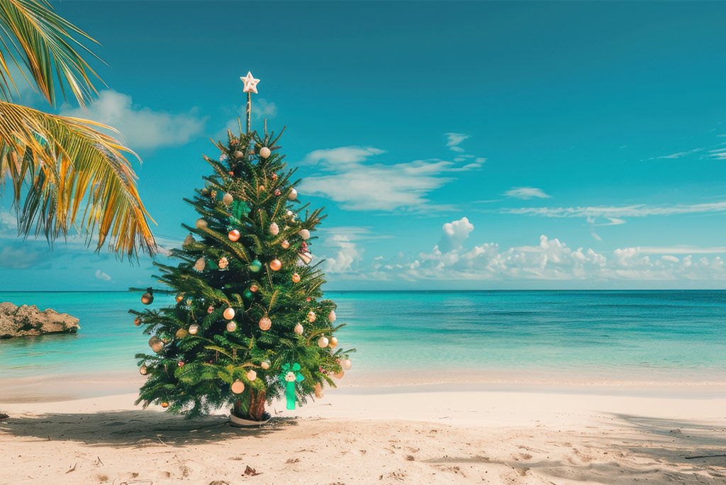 Vista paradisíaca de una playa con arena blanca y aguas cristalinas, ideal para disfrutar de las playas en esta Navidad.